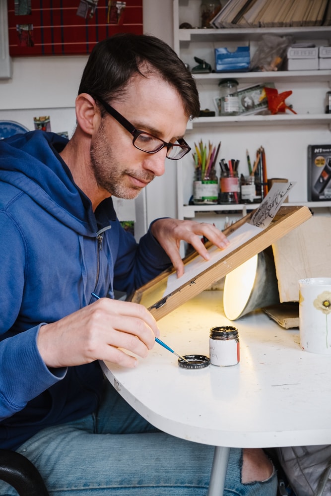 Alban Low, illustrating and inspecting the first Sampson Low chapbook back in 2015 (Photos by Bill Mudge)